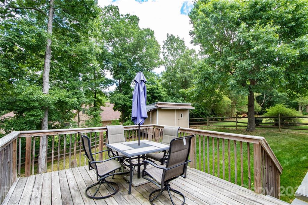 1360 Mistletoe Ridge Place Northwest Concord, NC 28027 - Photo 34 of 38 a view of a deck with furniture and trees