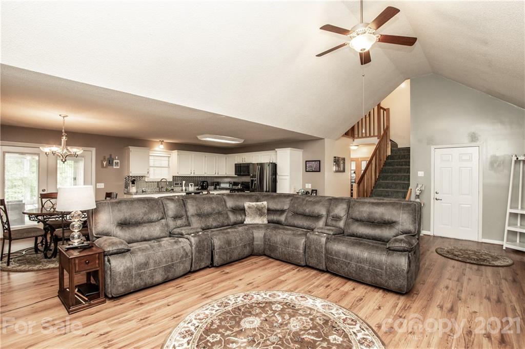 1360 Mistletoe Ridge Place Northwest Concord, NC 28027 - Photo 5 of 38 a living room with furniture and wooden floor