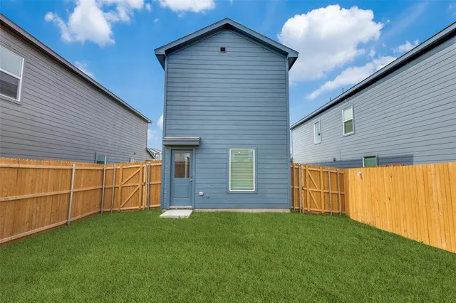 a view of a backyard of the house