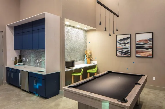 a view of kitchen with cabinets