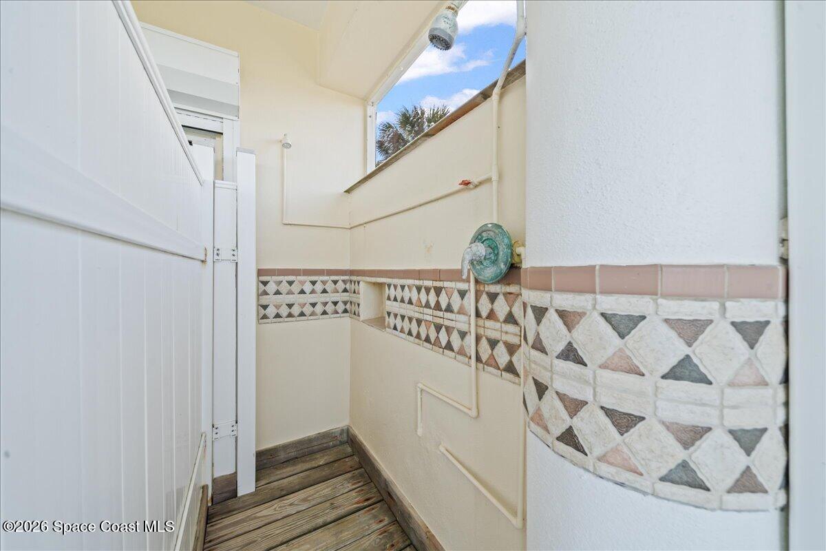 7585 South Hwy A1A Melbourne Beach, FL 32951 - Photo 34 of 45 a bathroom with a sink and mirror