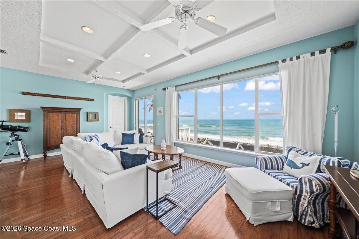 7585 South Hwy A1A Melbourne Beach, FL 32951 - Photo 5 of 45 a living room with furniture and a large window