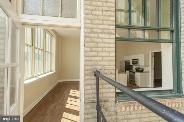 a view of a balcony with wooden floor and staircase