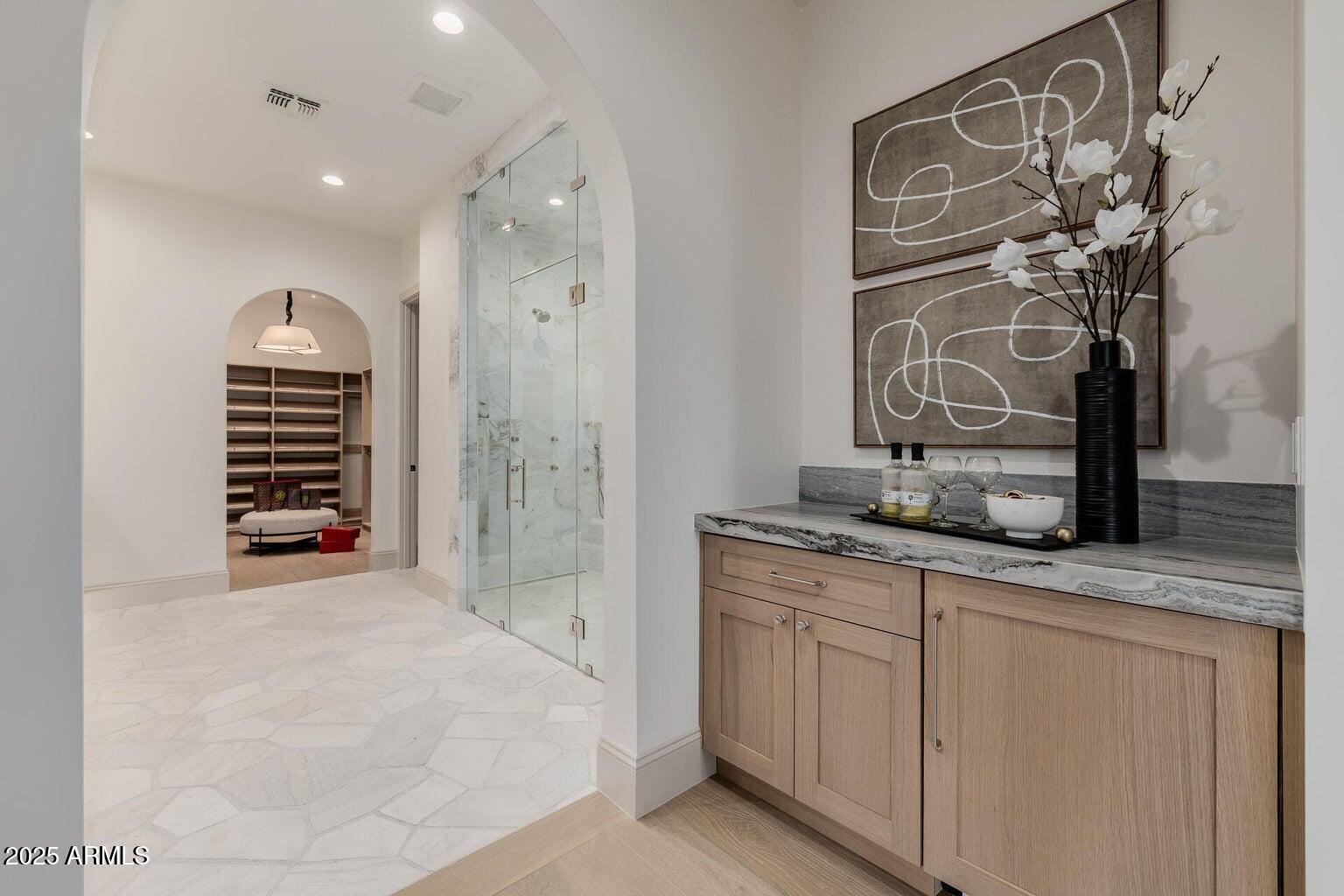 3301 East Elm Street Phoenix, AZ 85018 - Photo 14 of 36 a spacious bathroom with a granite countertop sink a mirror and a shower