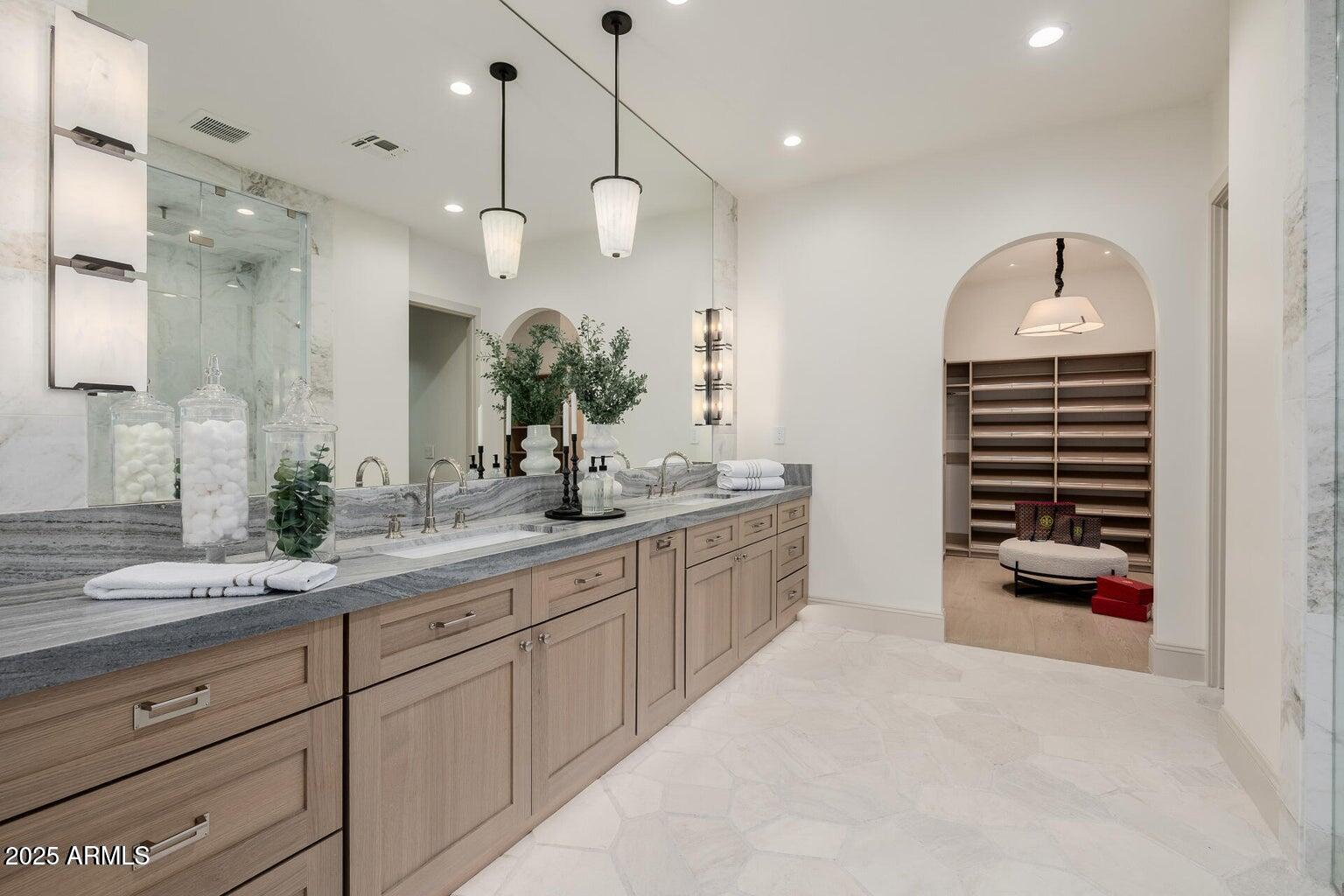 3301 East Elm Street Phoenix, AZ 85018 - Photo 15 of 36 a spacious bathroom with a sink a vanity and a large mirror
