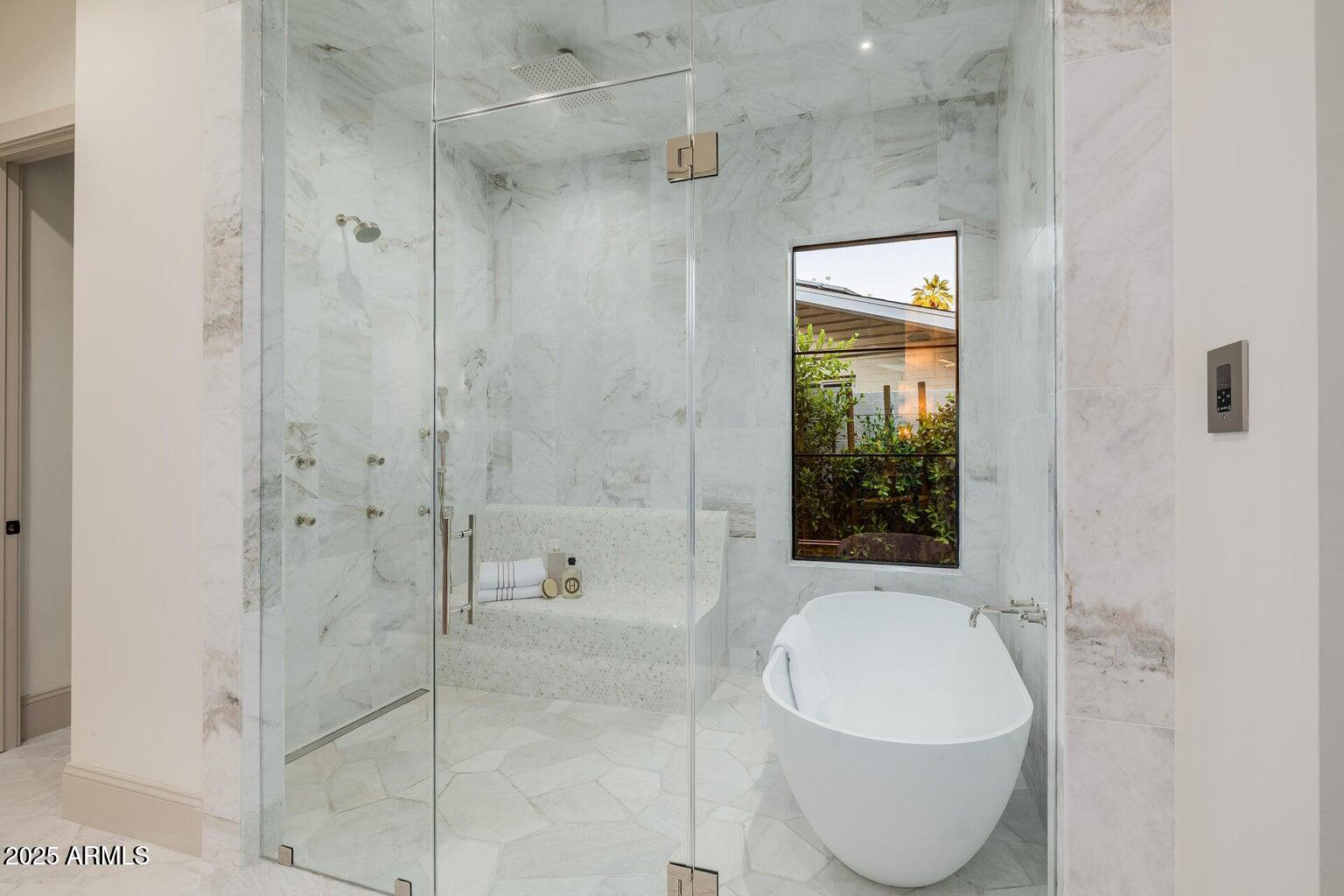 3301 East Elm Street Phoenix, AZ 85018 - Photo 16 of 36 a bathroom with a bathtub and shower