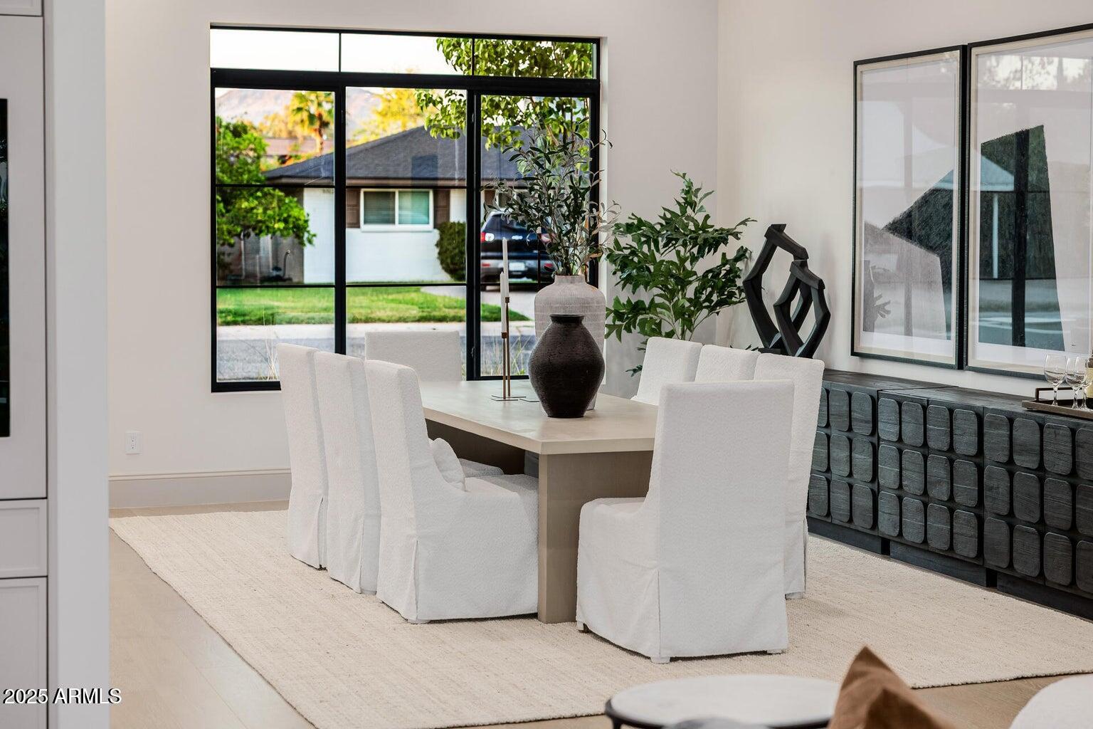 3301 East Elm Street Phoenix, AZ 85018 - Photo 2 of 36 a dining room with furniture and large windows