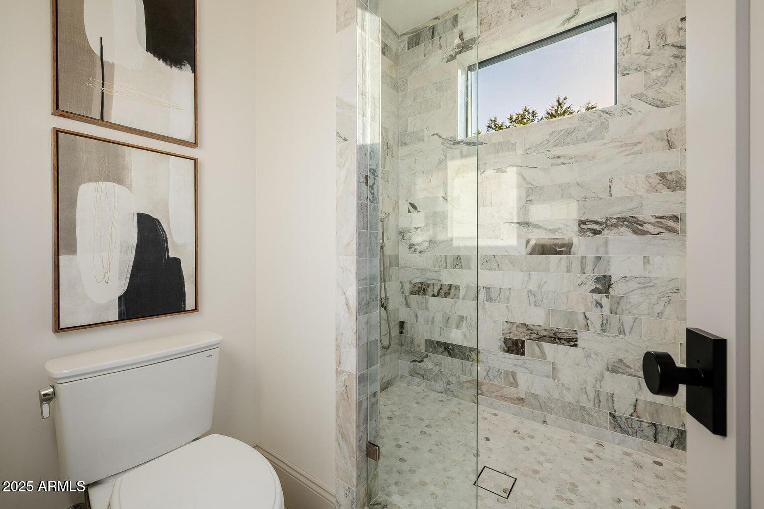 3301 East Elm Street Phoenix, AZ 85018 - Photo 21 of 36 a bathroom with a toilet sink and shower
