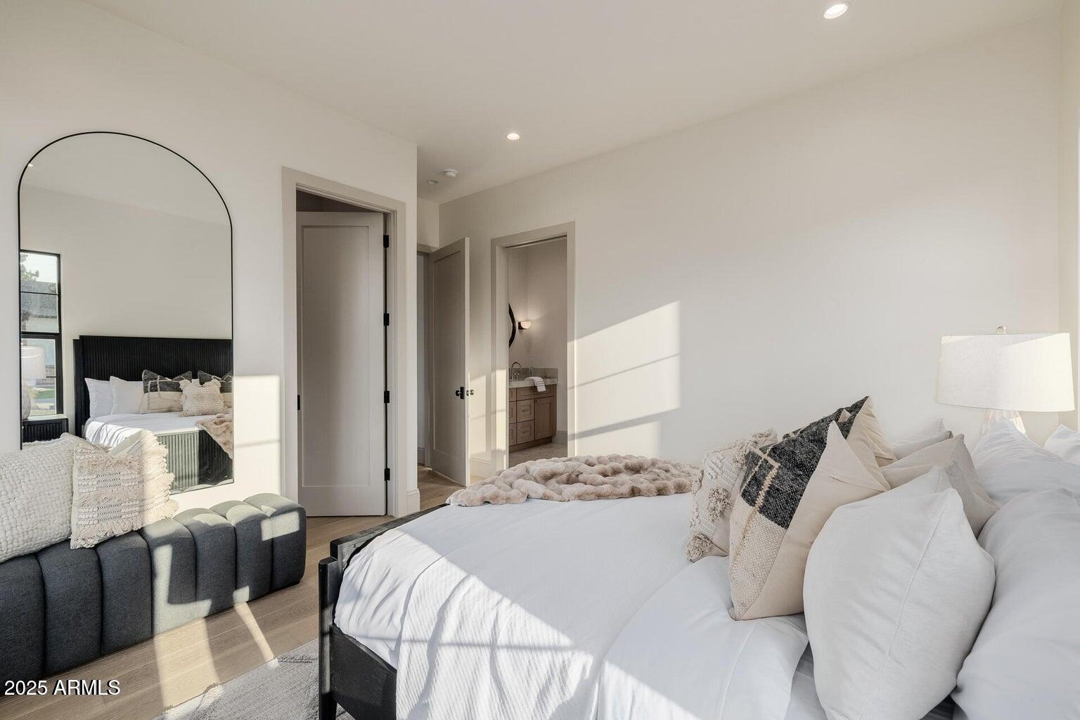 3301 East Elm Street Phoenix, AZ 85018 - Photo 22 of 36 a bedroom with a bed and a mirror