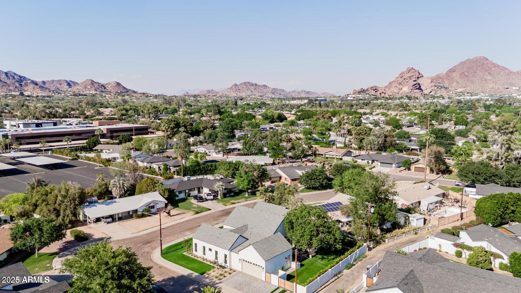 3301 East Elm Street Phoenix, AZ 85018 - Photo 36 of 36 an aerial view of a city with lots of residential buildings ocean and mountain view in back