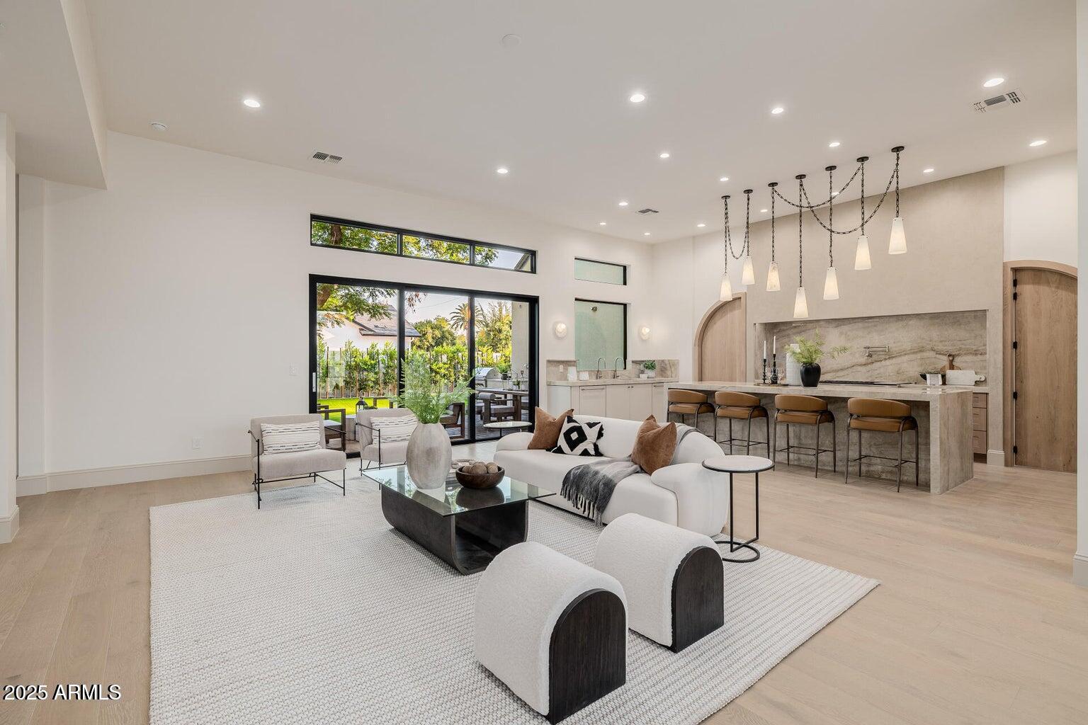 3301 East Elm Street Phoenix, AZ 85018 - Photo 5 of 36 a living room with lots of furniture and view of kitchen