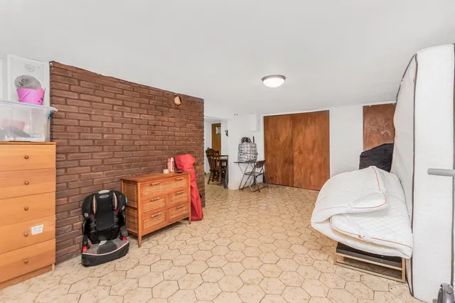 a bedroom with bed and window