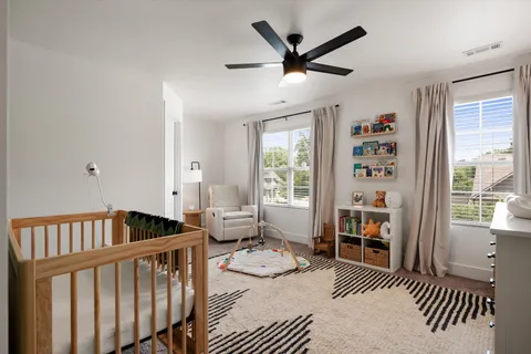 a bedroom with furniture and a window