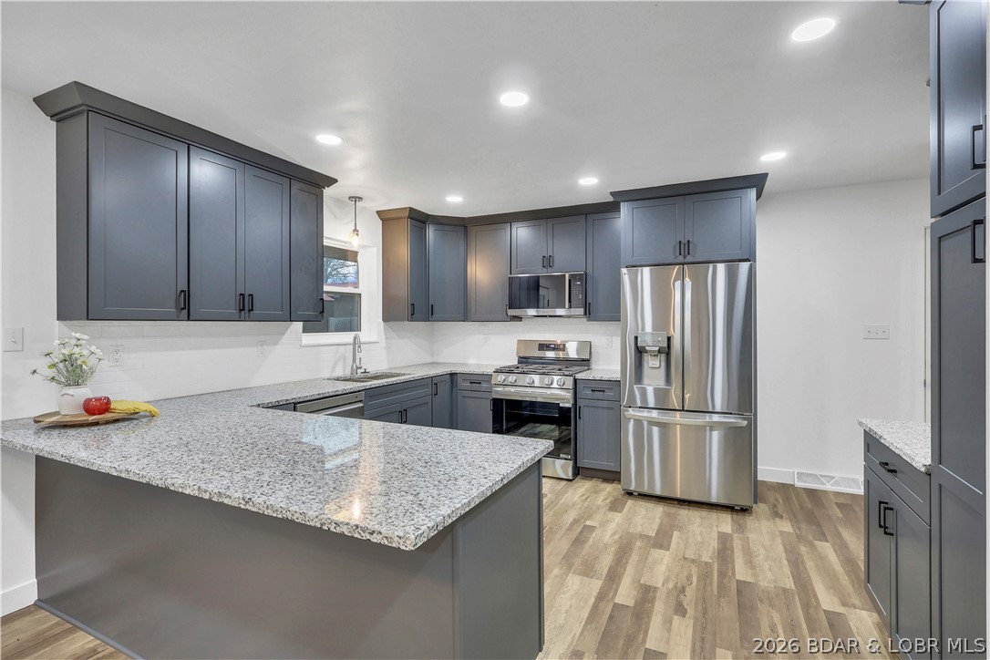 107 Lynn Avenue Eldon, MO 65026 - Photo 11 of 55 Gas range with frenchdoor refrigerator