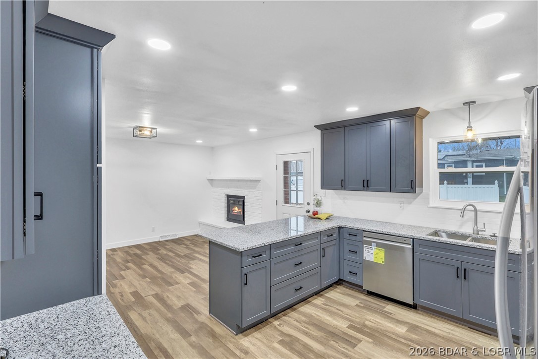 107 Lynn Avenue Eldon, MO 65026 - Photo 12 of 55 Kitchen to dining seamless