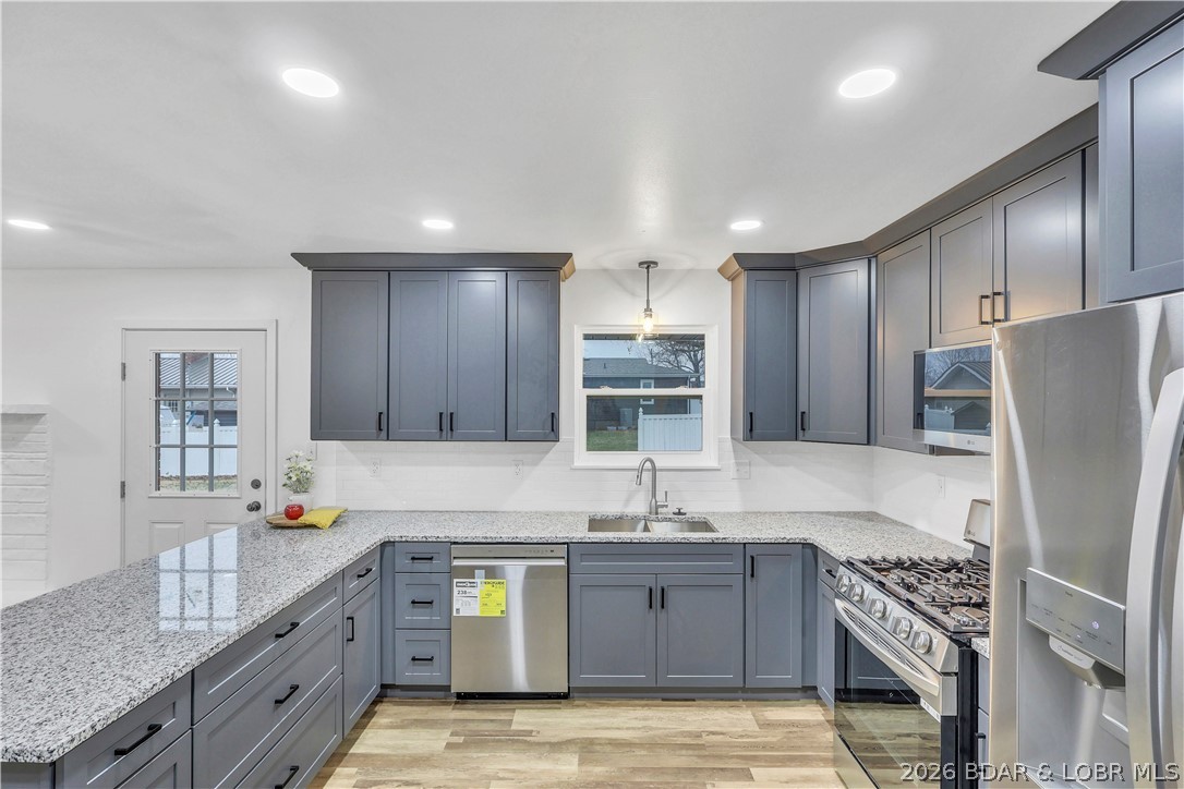 107 Lynn Avenue Eldon, MO 65026 - Photo 13 of 55 Bright open flow, with stainless glow