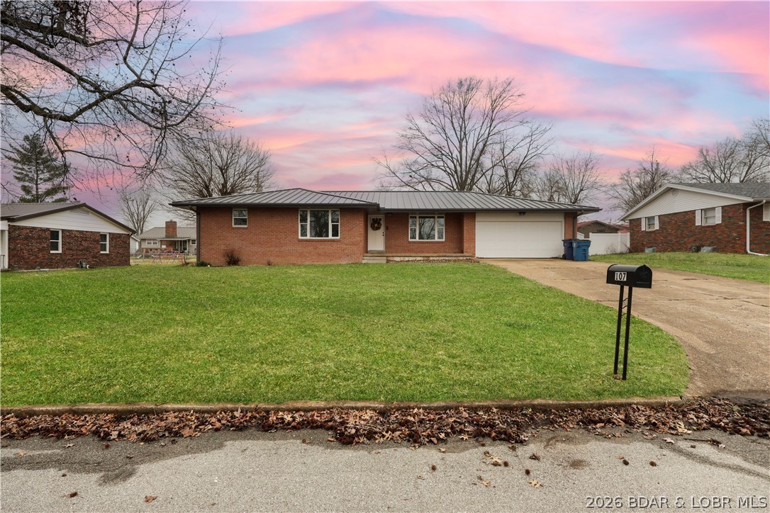 107 Lynn Avenue Eldon, MO 65026 - Photo 29 of 55 Covered welcome porch swing ready