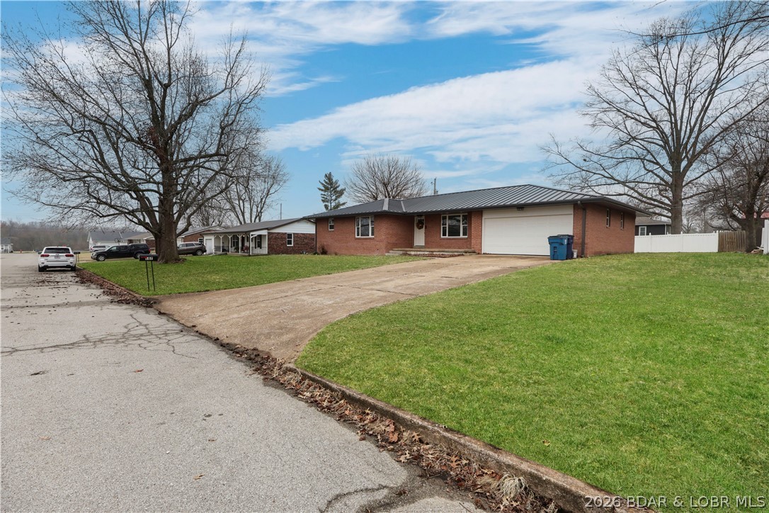 107 Lynn Avenue Eldon, MO 65026 - Photo 30 of 55 Street view presBrick & Metal roof!