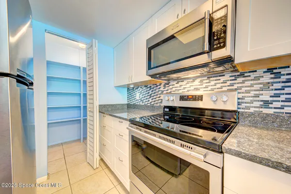 a view of storage and utility room with washer and dryer