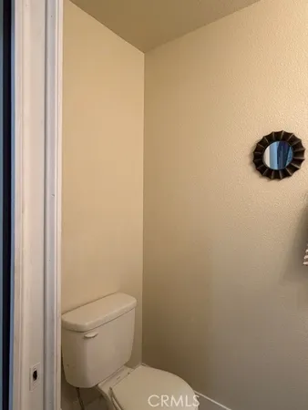 a bathroom with a toilet and a sink