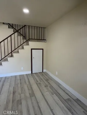 a view of an empty room with stairs
