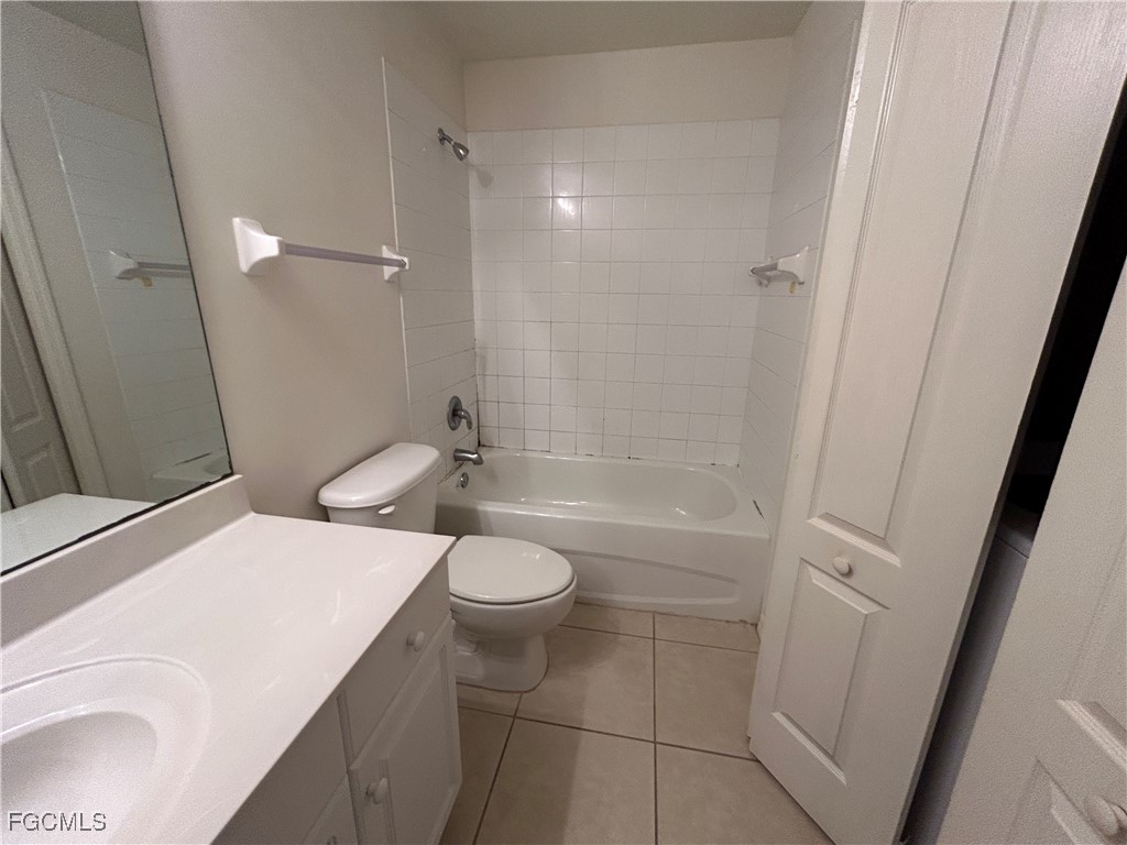 9410 Ivy Brook Run, Unit 206 Fort Myers, FL 33913 - Photo 12 of 16 a bathroom with a sink a toilet and shower