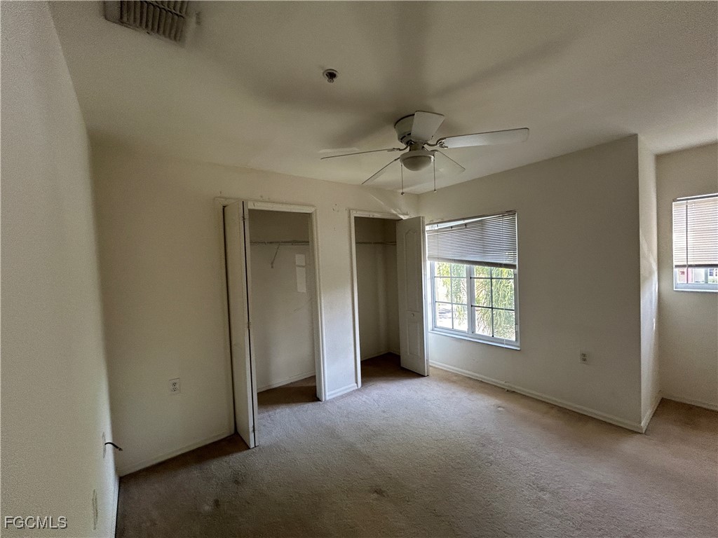 9410 Ivy Brook Run, Unit 206 Fort Myers, FL 33913 - Photo 14 of 16 a view of an empty room with a window