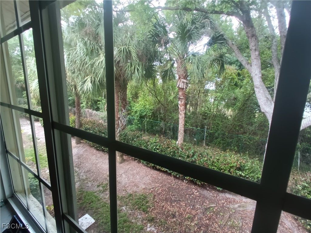 9410 Ivy Brook Run, Unit 206 Fort Myers, FL 33913 - Photo 15 of 16 a view of a forest from a window