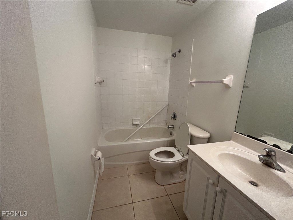 9410 Ivy Brook Run, Unit 206 Fort Myers, FL 33913 - Photo 10 of 16 a bathroom with a sink and a mirror