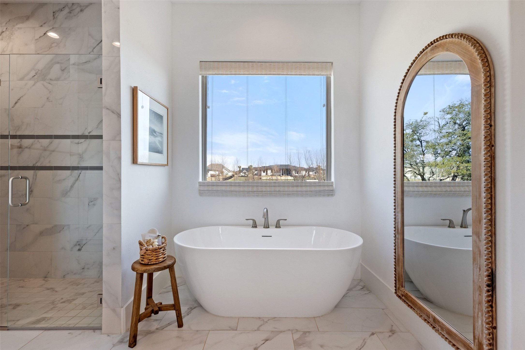 105 Deer Valley Road Georgetown, TX 78628 - Photo 17 of 40 Bathroom featuring a soaking tub, healthy amount of natural light, and a marble finish shower