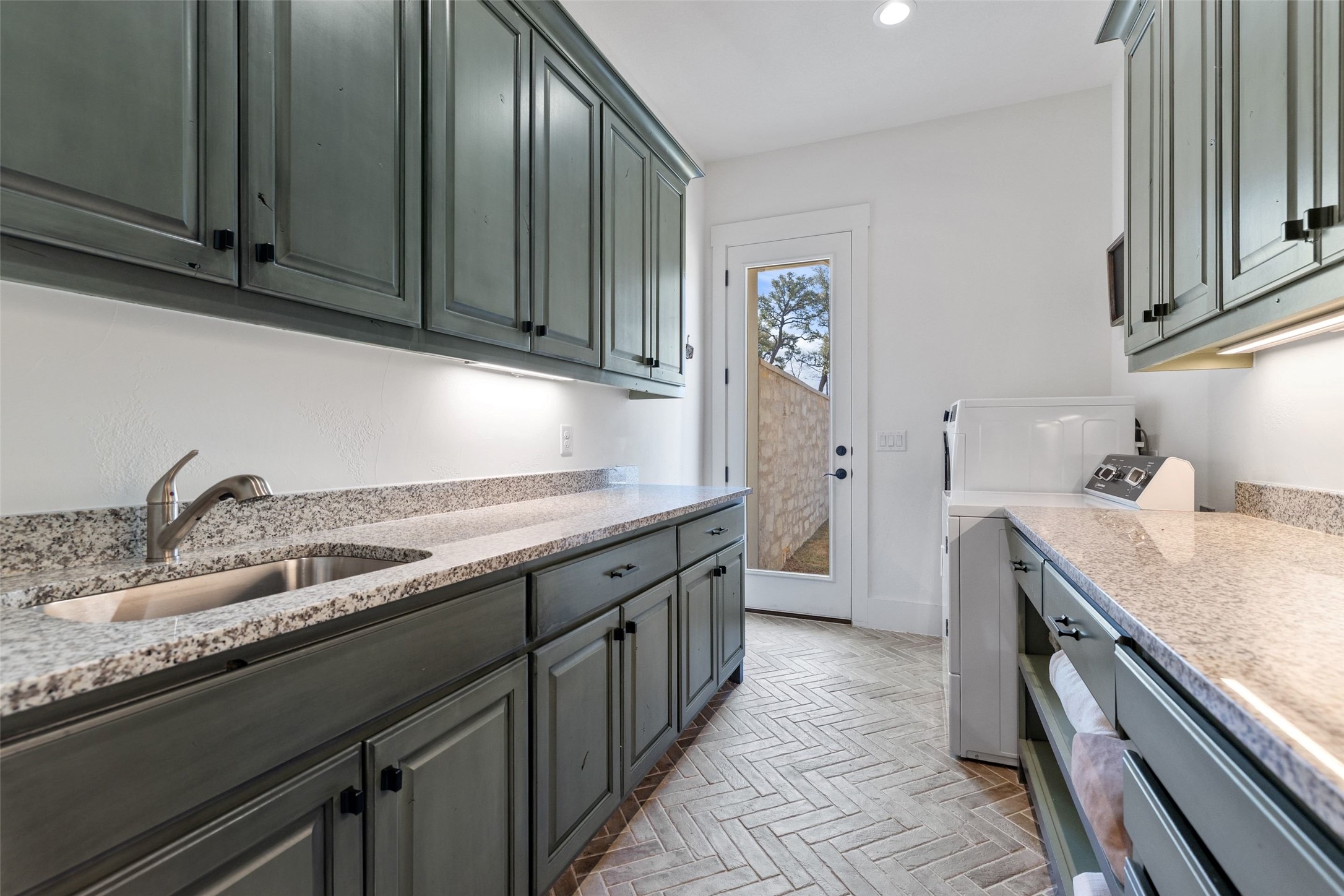 105 Deer Valley Road Georgetown, TX 78628 - Photo 28 of 40 Laundry room featuring washer / dryer and recessed lighting