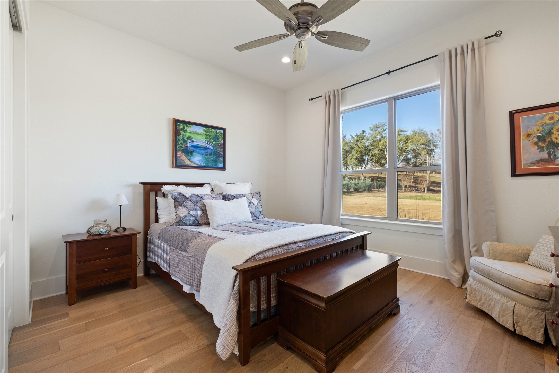 105 Deer Valley Road Georgetown, TX 78628 - Photo 32 of 40 Bedroom with light wood-style flooring, a ceiling fan, recessed lighting, and a closet