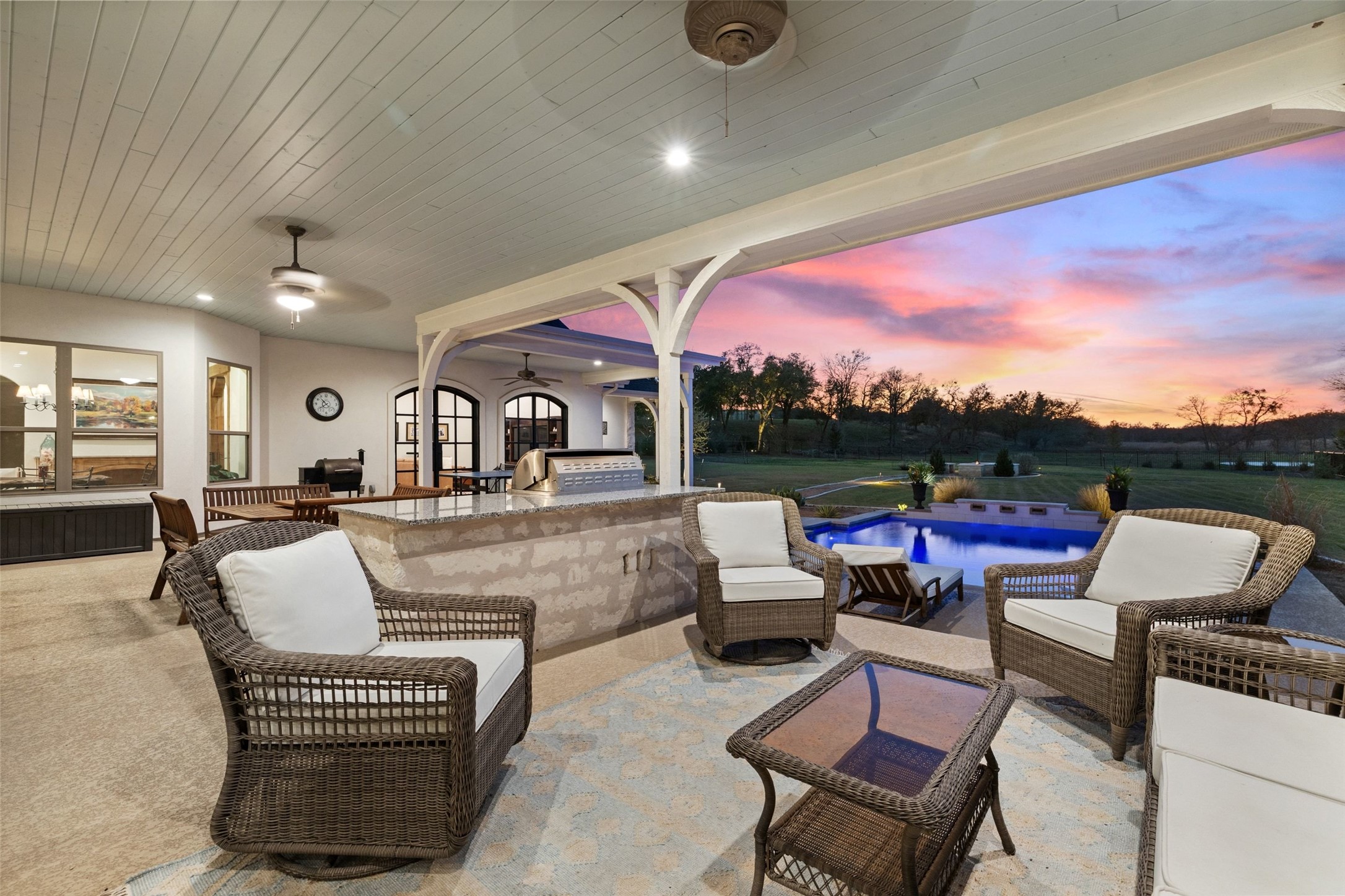 105 Deer Valley Road Georgetown, TX 78628 - Photo 35 of 40 Patio terrace at dusk featuring an outdoor pool, a patio area, an outdoor kitchen and area to lounge, and a ceiling fan