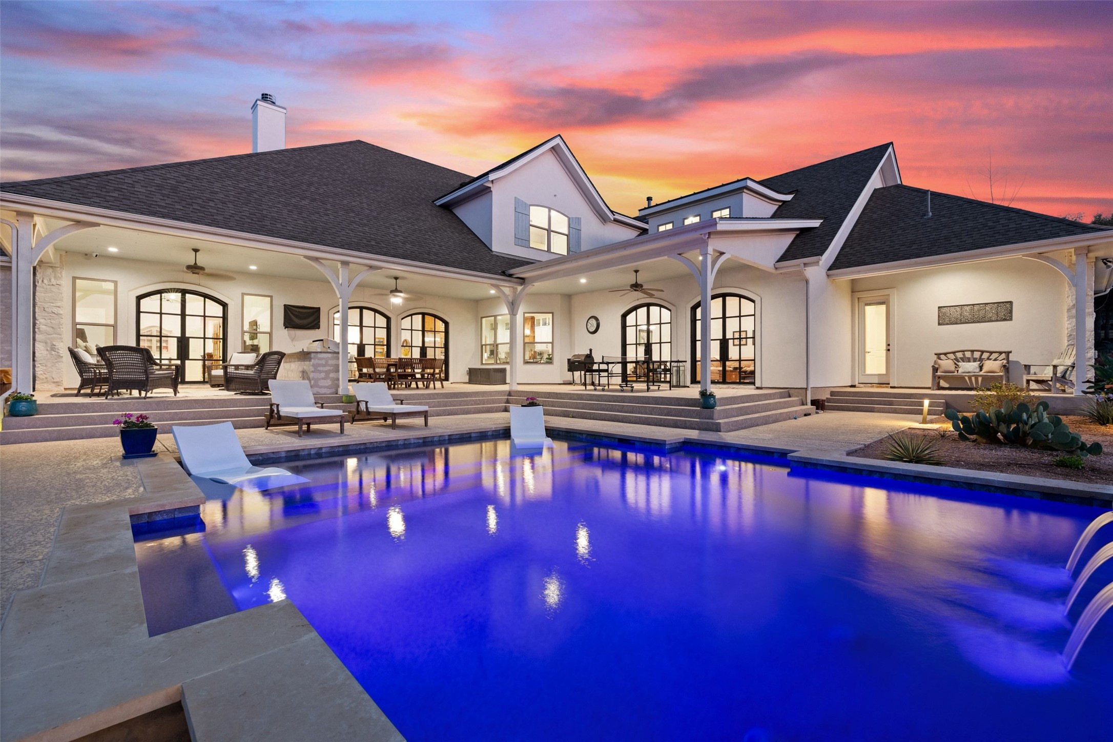 105 Deer Valley Road Georgetown, TX 78628 - Photo 37 of 40 Rear view of property featuring a ceiling fan, a patio area, a chimney, stucco siding, and roof with shingles