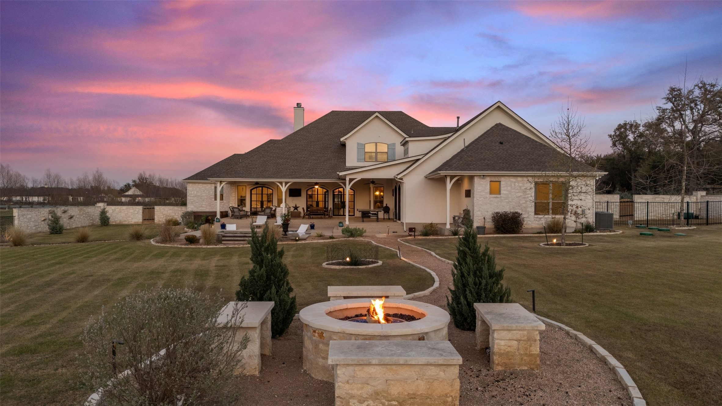 105 Deer Valley Road Georgetown, TX 78628 - Photo 38 of 40 Rear view of house with a patio area, a chimney, and a fire pit
