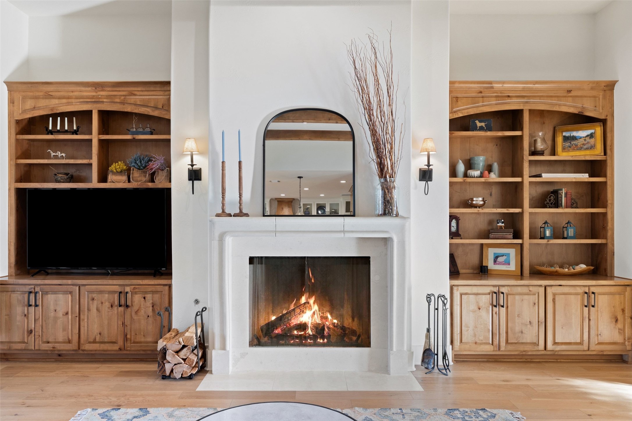 105 Deer Valley Road Georgetown, TX 78628 - Photo 4 of 40 Living area featuring a fireplace with flush hearth, light wood-style floors, and built in shelves