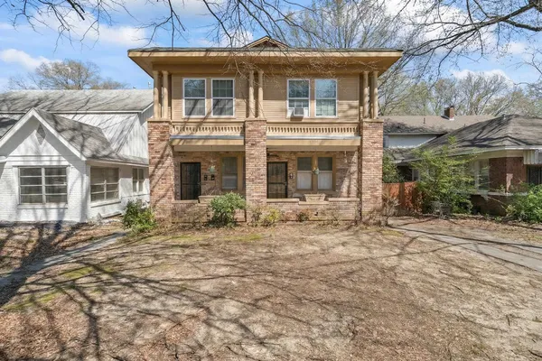 front view of a house with a small yard