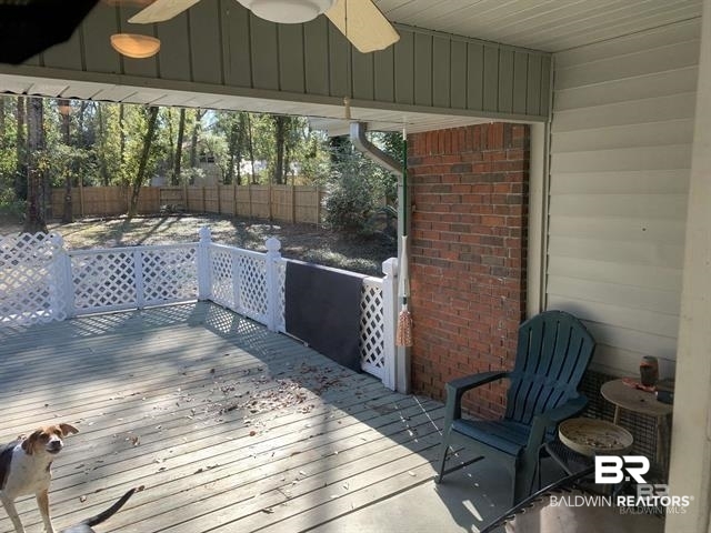 23393 Miflin Road Foley, AL 36535 - Photo 10 of 12 Wooden deck with fence and ceiling fan