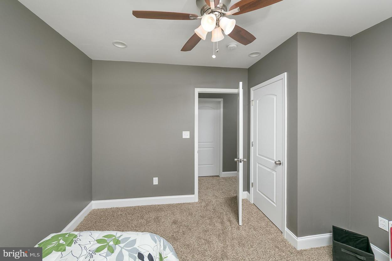 8221 Longpoint Road Baltimore, MD 21222 - Photo 18 of 24 a view of an empty room and chandelier fan