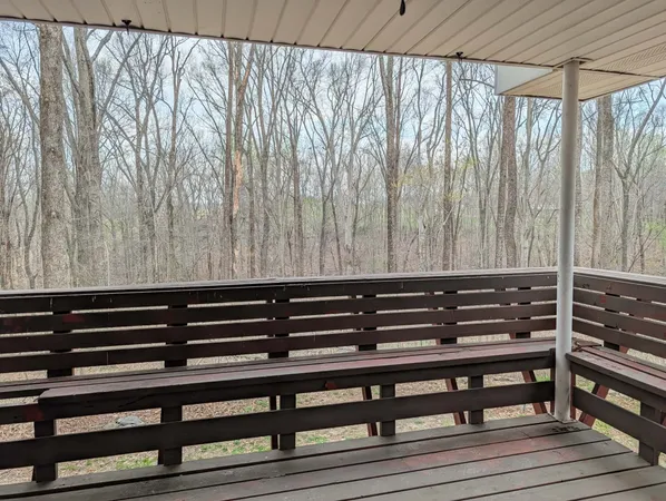 a view of wooden bench in a porch