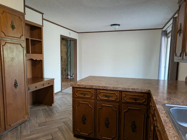 a view of a refrigerator in kitchen