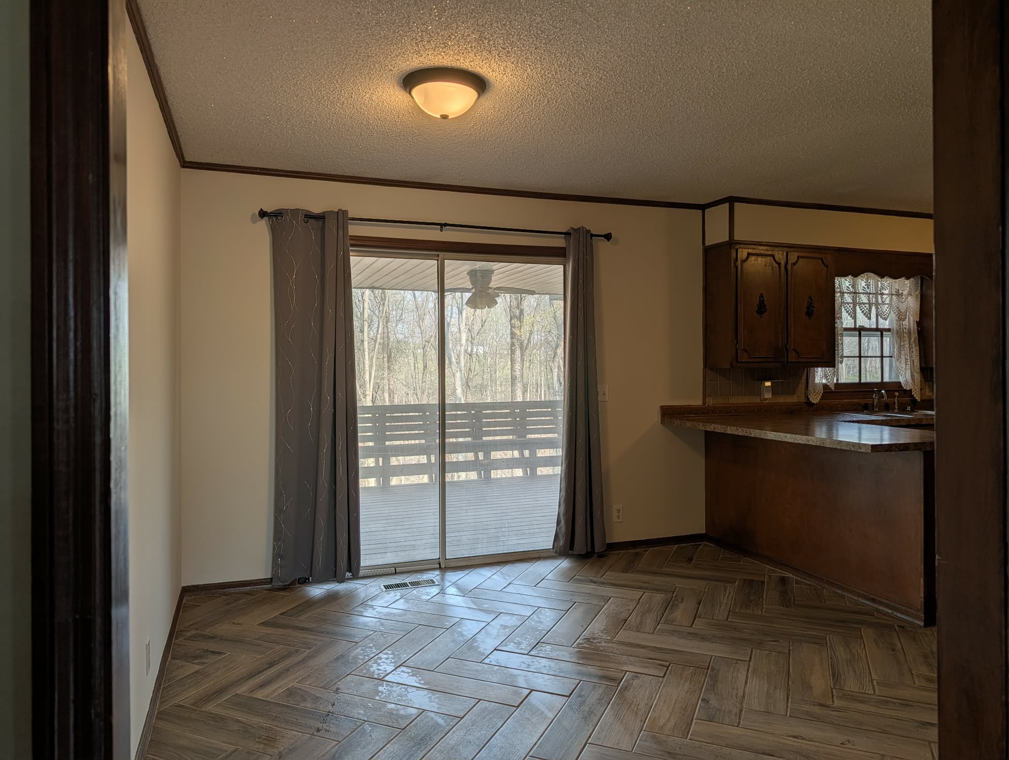 1581 Galen Road Lafayette, TN 37083 - Photo 17 of 36 a view of an empty room with a fireplace and a window