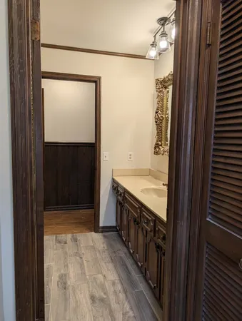 a bathroom with a sink and a mirror
