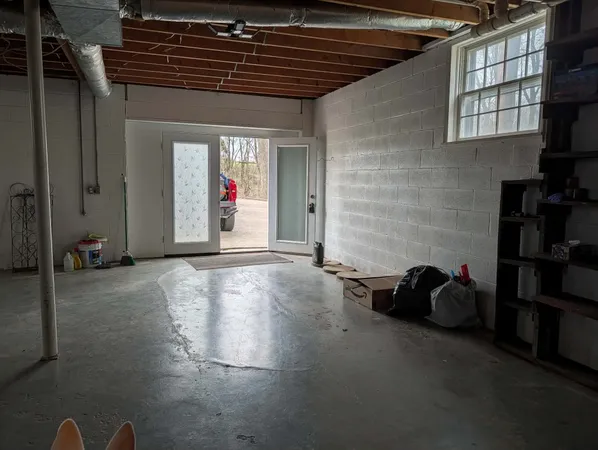 a view of empty room with wooden ceiling