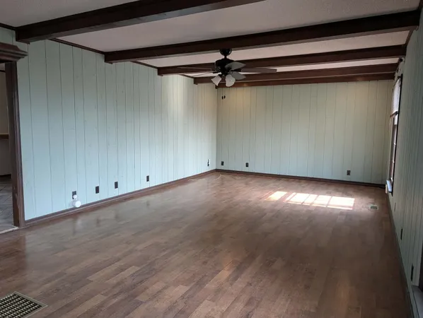 a view of room with hardwood floor