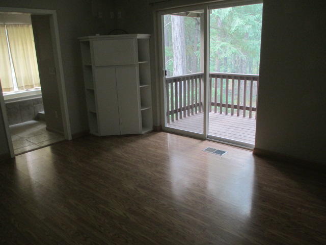 100 Estrellita Road Trinity Center, CA 96091 - Photo 32 of 53 a view of a room with wooden floor and a window