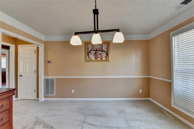 a view of a livingroom with stairs