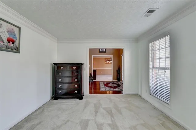 a kitchen with granite countertop wooden cabinets and a sink