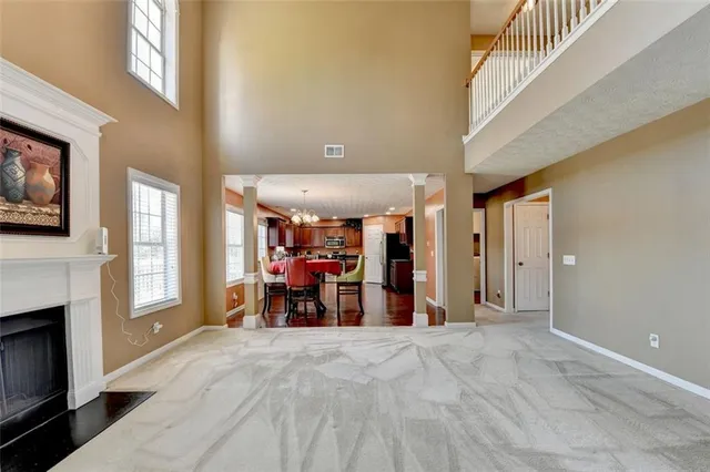 a bedroom with a bed and a flat tv screen on dresser