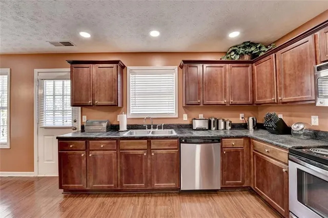 a work room with furniture and a large window